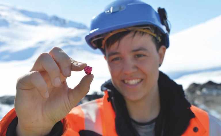 Greenland Ruby Photo: Mille Schiøtt Kongstad, Greenlandic geologist, holding a rough gem stone from the Aappaluttoq mine. (Photo: Greenland Ruby)